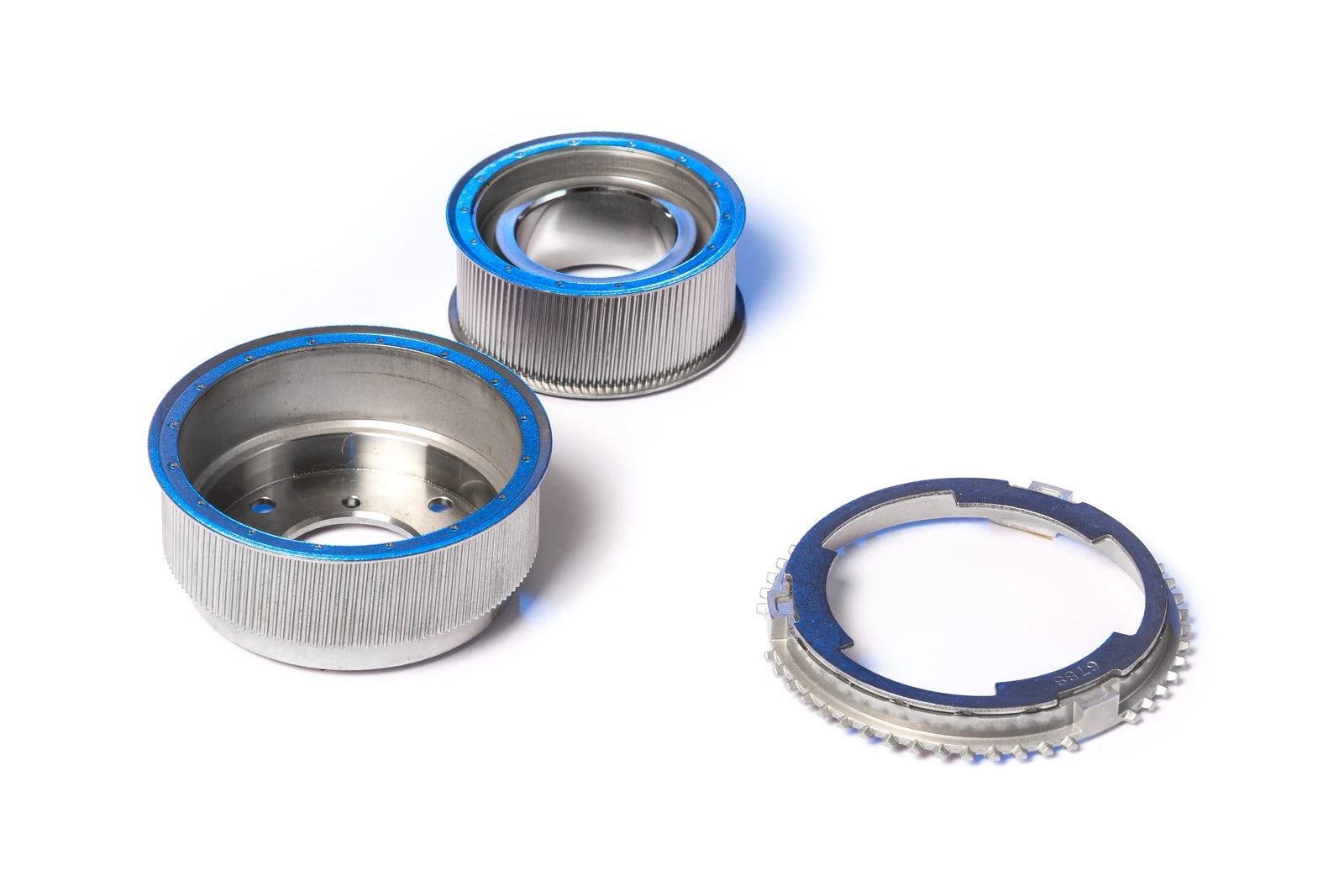 Splined sheet metal drums and a toothed synchronizer ring, capacitor discharge welded.